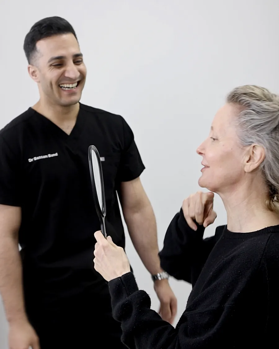 Dr Band sharing the mirror moment with a smiling patient