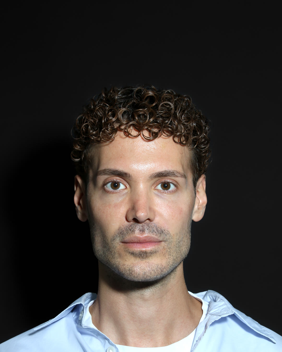Male front view with a rested under-eye area, unretouched